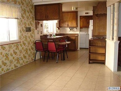 Dining area adjacent to open kitchen.