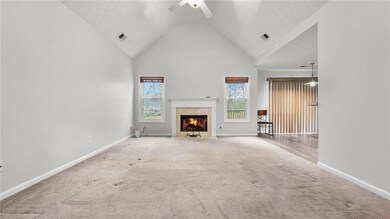 Unfurnished living room with a fireplace, carpet f