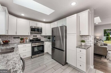 Granite countertops and sleek stainless steel appl