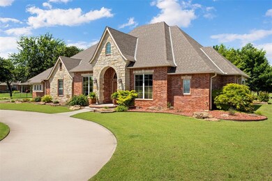 View of front of house featuring roof with shingles, a front lawn, and stone siding
