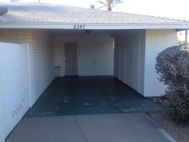 Carport with storage closets