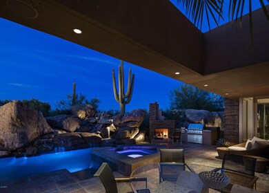 Pool, spa and patio after sunset
