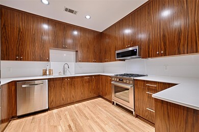 Kitchen featuring sink, backsplash, stainless stee