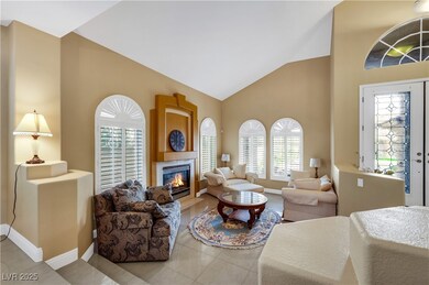 Tiled living room with high vaulted ceiling, a til