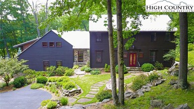 Colonial Saltbox architectural style with rustic m