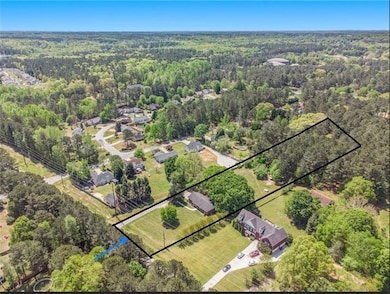 Aerial overview of property's location featuring property boundaries highlighted