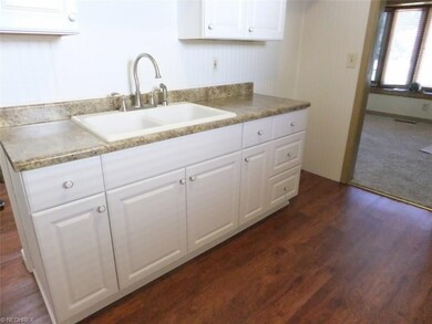 New Hickory nutmeg laminate floors in kitchen and 