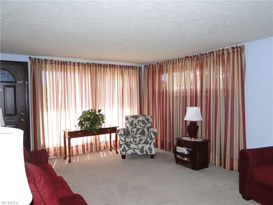 Living Room featuring 2 good sized windows and a g