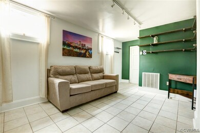 Family Room with Tile Floors, Track Lighting and B