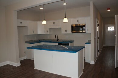 Large Kitchen Island will accommodate 3-4 Counter Height stools.