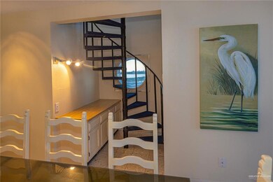 Stairs featuring light tile floors