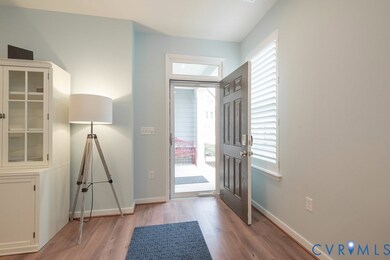 Entrance foyer featuring light wood-type flooring and healthy amount of natural light