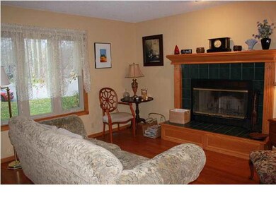 Main floor living room with woodburning fireplace 