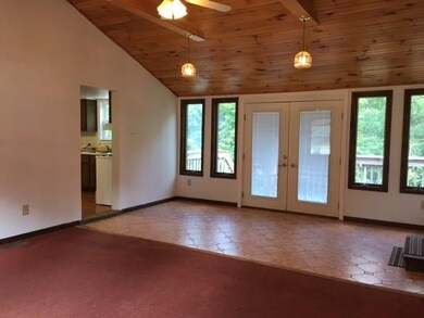 The family room has gorgeous cathedral ceilings an