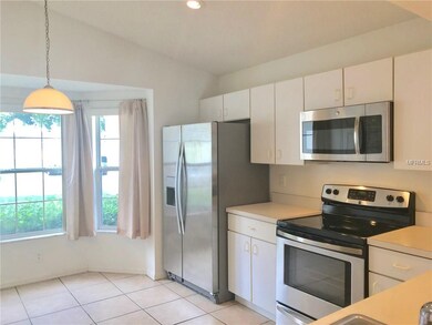Vaulted ceilings in the kitchen enhance the open f
