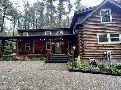 Side view of property with covered porch