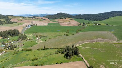 Aerial view of property's location featuring rural landscape and a mountain backdrop
