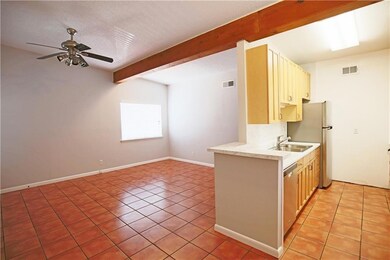 Kitchen featuring visible vents, beam ceiling, ce