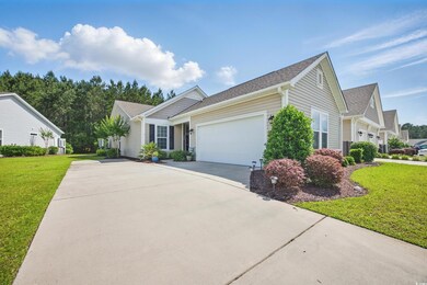 Ranch-style home featuring concrete driveway, an a