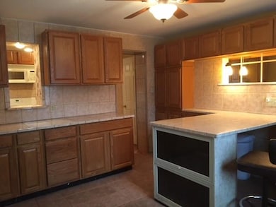 Multiple purpose room located right off the kitche
