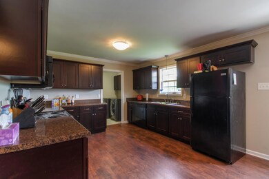  Kitchen has a large window over the sink to allow an abundance of natural light. 