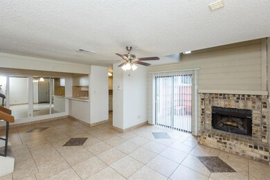 Living Room with gorgeous brick fireplace and slid