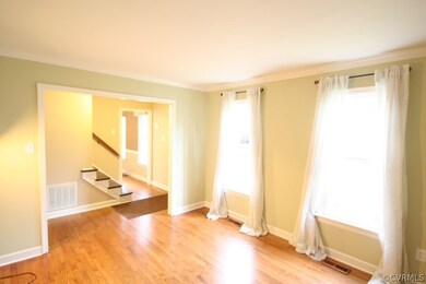Formal living room with hardwood floors and tons o