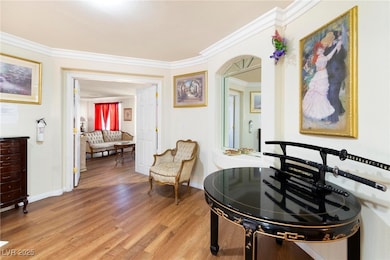 Sitting room featuring light wood-type flooring an