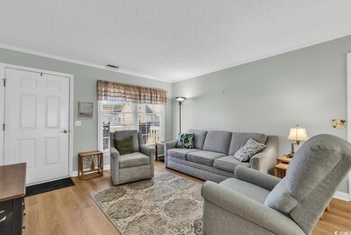 Living room with wood-type flooring, ornamental mo