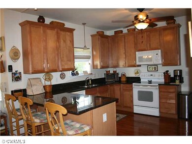 Kitchen - Gorgeous kitchen features granite countertops, hardwood floors, breakfast nook and more!