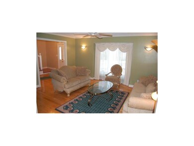 Spacious Formal Living Room with Gorgeous Hardwood