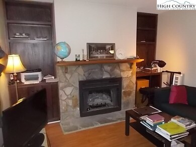 Gas log fireplace with built in book shelves