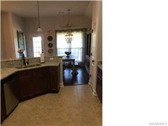 The kitchen opens into the family room and breakfa
