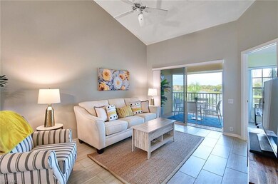 Living room with high vaulted ceiling, ceiling fan