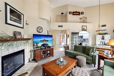 Living room featuring light colored carpet, a high