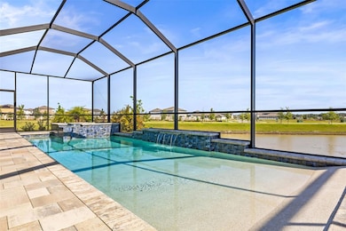 Zero entry pool and 12 person hot tub overlooking the pond