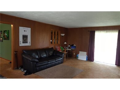 Huge Family/Great Room has sliding door into the S