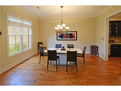 The formal Dining Room boasts nail down hardwood f
