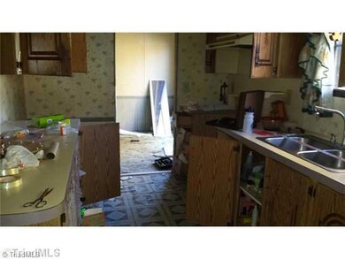 Exterior Front. Kitchen- home will not be trashed out