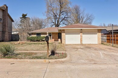 Single story home featuring driveway, a garage, fe
