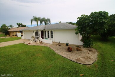 Home located in a quiet, well-established neighborhood across the street from high-priced Gulf Access Canal Homes.