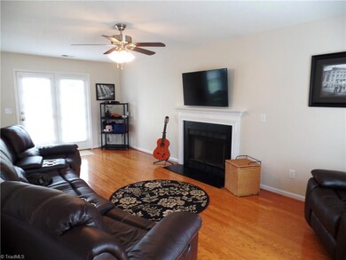 Large family room with beautiful hardwoods.
