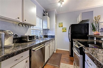 The kitchen has a pantry  across from the refriger