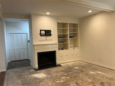 The family room has high ceilings, recessed lighti