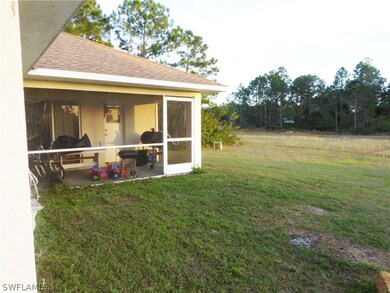 Screened in porch and large yard backing up to can