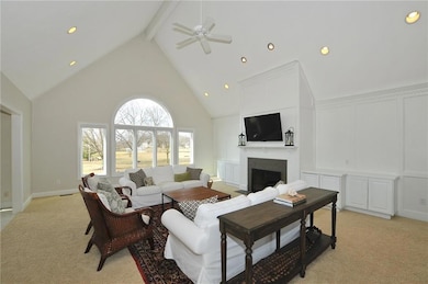 The great room is quite grand with two story cathedral ceiling, gas log fireplace and built in storage. And the golf course/pond view from the bank of windows really brings mother nature into this fantastic space as well.