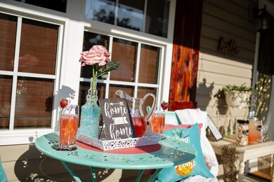 Covered Front porch perfect for mid-morning brunch.
