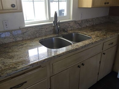 Granite counters & under mount sink.  Cabinets hav