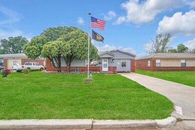 Ranch-style home with a front lawn