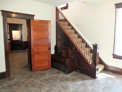 Large foyer could make a nice mud room or sitting 